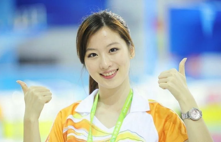 A Beautiful female volunteer services in the Asian Games swimming pool A Beautiful female volunteer services in the Asian Games swimming pool