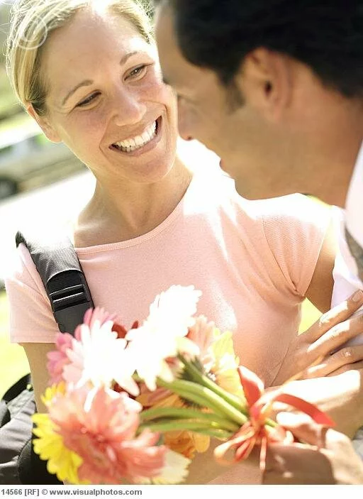 man giving woman bunch of flowers woman smiling Beautiful and cute flowers girl new photo galley