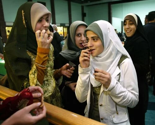 Muslim Girls Breaking Fast during Ramadan