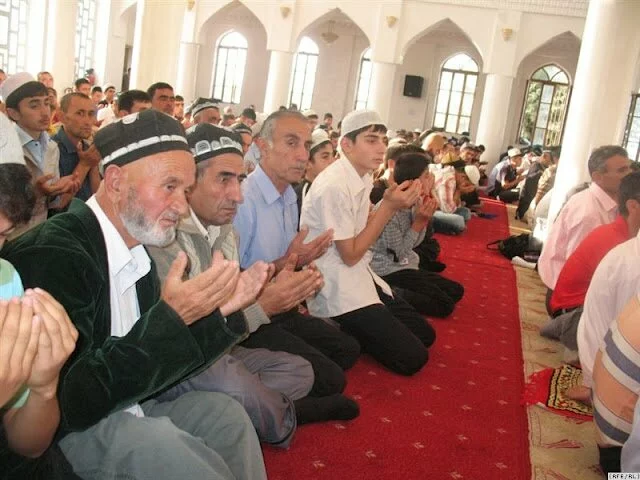 Tajikis pray in Dushanbe's central mosque during the feast of Eid al-Fitr. Islam's growing influence is showing up in the new fashion for names